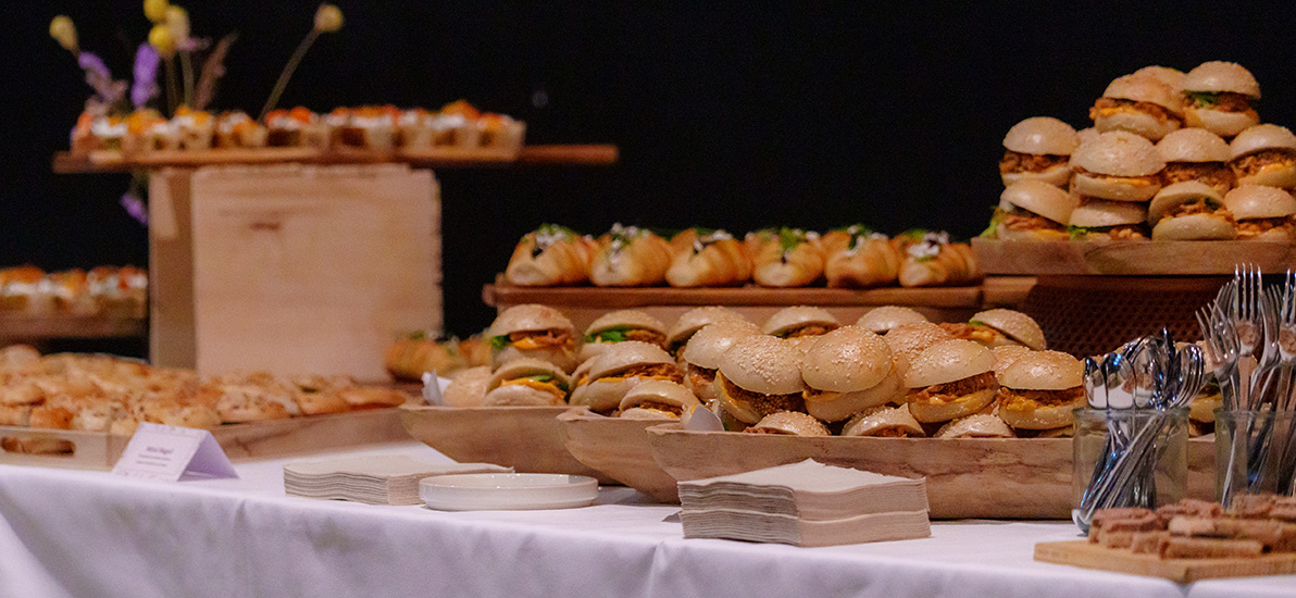 Various applications and gourmet items such as mini burgers, mini focaccias, and mini bagels for the launch event